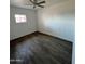 Cozy bedroom featuring wood-style flooring and bright window at 2853 W Ohio St, Apache Junction, AZ 85120
