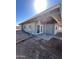 The covered patio offers an outdoor retreat with access from the backyard and through glass doors at 2853 W Ohio St, Apache Junction, AZ 85120