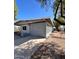 Charming single-story home features a low-pitched roof, light gray exterior, and lattice privacy screens at 2853 W Ohio St, Apache Junction, AZ 85120