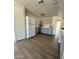 Bright kitchen with gray cabinets, white refrigerator, and modern countertops at 2853 W Ohio St, Apache Junction, AZ 85120