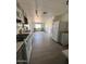 Open concept kitchen with stainless appliances and view into living room at 2853 W Ohio St, Apache Junction, AZ 85120