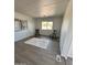 Minimalist interior with two chairs, a white rug, and natural light streaming through the windows at 2853 W Ohio St, Apache Junction, AZ 85120