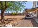 Large backyard with covered patio, dirt and gravel at 3201 W Evans Dr, Phoenix, AZ 85053