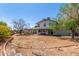 Backyard with dirt, trees, seating and playground at 3201 W Evans Dr, Phoenix, AZ 85053