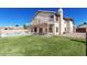 Large backyard featuring a covered patio, pool, and grassy area; ideal for outdoor activities and entertaining at 3761 W Kent Dr, Chandler, AZ 85226