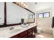 Bright bathroom featuring double sinks, a large mirror, and a shower-tub combination at 3761 W Kent Dr, Chandler, AZ 85226