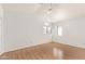 A bright bedroom with wood floors and dual windows at 3761 W Kent Dr, Chandler, AZ 85226