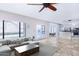 Inviting living room with travertine floors, abundant natural light, and seamless transition to outdoor pool area at 3761 W Kent Dr, Chandler, AZ 85226