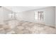 Inviting living room with a large window and tile flooring, offering a versatile space for relaxation and entertainment at 3761 W Kent Dr, Chandler, AZ 85226