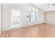 Open living room with wood floors, vaulted ceilings, and large windows at 3761 W Kent Dr, Chandler, AZ 85226