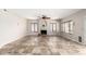 Spacious living room featuring tile floors, neutral paint, a fireplace, and bright, sunny windows at 3761 W Kent Dr, Chandler, AZ 85226