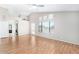 Spacious living room featuring vaulted ceilings, a ceiling fan and wood floors at 3761 W Kent Dr, Chandler, AZ 85226