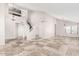 Open-concept living area with high ceilings, tile flooring, and staircase, creating a spacious and welcoming atmosphere at 3761 W Kent Dr, Chandler, AZ 85226