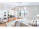 Bright main bedroom with large windows, wood floors, vaulted ceiling, and ensuite bathroom at 3761 W Kent Dr, Chandler, AZ 85226