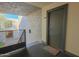 Hallway entrance to unit 201 with apartment number above the door and a door mat in front at 4120 N 78Th St # 201, Scottsdale, AZ 85251