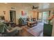 Comfortable living room featuring a ceiling fan, hardwood floors, and neutral wall paint at 4120 N 78Th St # 201, Scottsdale, AZ 85251