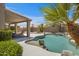 Beautiful backyard featuring a covered patio, pool with rock accents, and lush landscaping at 4207 E Rockledge Rd, Phoenix, AZ 85044