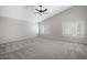 Spacious bedroom features vaulted ceilings, soft carpet, and plenty of natural light at 4207 E Rockledge Rd, Phoenix, AZ 85044