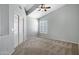 Neutral bedroom featuring carpet, vaulted ceilings and a ceiling fan at 4207 E Rockledge Rd, Phoenix, AZ 85044