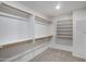 Walk-in closet features built in shelves and hanging storage at 4207 E Rockledge Rd, Phoenix, AZ 85044