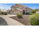 Inviting two-story home with desert landscaping and a spacious three-car garage at 4207 E Rockledge Rd, Phoenix, AZ 85044