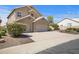Lovely two-story home featuring a three-car garage and desert landscaping at 4207 E Rockledge Rd, Phoenix, AZ 85044