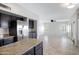Bright open floor plan featuring a modern kitchen and living area with stylish accents at 4207 E Rockledge Rd, Phoenix, AZ 85044