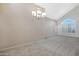 Spacious living room featuring vaulted ceilings and large windows with natural light at 4207 E Rockledge Rd, Phoenix, AZ 85044