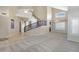Inviting living room featuring a neutral color scheme and a curved staircase at 4207 E Rockledge Rd, Phoenix, AZ 85044