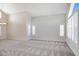Bright, open living room featuring a chandelier, neutral paint, and ample natural light at 4207 E Rockledge Rd, Phoenix, AZ 85044