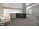 Open living room featuring carpet, a ceiling fan and built in shelving at 4207 E Rockledge Rd, Phoenix, AZ 85044