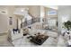 Bright living room featuring a staircase, neutral tones, and modern decor at 4207 E Rockledge Rd, Phoenix, AZ 85044
