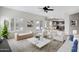 Bright living room featuring neutral tones, modern furniture, and access to the outdoor pool at 4207 E Rockledge Rd, Phoenix, AZ 85044
