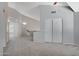 Bright loft area featuring carpet, a ceiling fan and sliding closet doors at 4207 E Rockledge Rd, Phoenix, AZ 85044