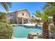 Inviting backyard pool area featuring mature landscaping, stone accents, and a covered patio at 4207 E Rockledge Rd, Phoenix, AZ 85044