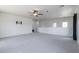 Expansive bonus room boasts recessed lighting, ceiling fan, and neutral tones, perfect for versatile use at 44175 W Knauss Dr, Maricopa, AZ 85138