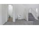 View of the hallway and stairs that lead to the second floor, and bathroom on the side at 44175 W Knauss Dr, Maricopa, AZ 85138