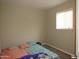 Cozy bedroom with natural light and comfortable bedding at 4624 S 19Th Ave, Phoenix, AZ 85041