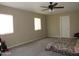 Spacious bedroom with a ceiling fan and carpeted floors at 4624 S 19Th Ave, Phoenix, AZ 85041