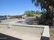 Inviting exterior space with vibrant landscaping and mature tree, enhancing curb appeal at 4624 S 19Th Ave, Phoenix, AZ 85041