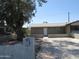 Charming single-story home with mature tree and concrete driveway, providing ample parking space at 4624 S 19Th Ave, Phoenix, AZ 85041