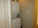 Efficient laundry room with a stacked washer and dryer unit at 4624 S 19Th Ave, Phoenix, AZ 85041