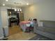 Inviting living space featuring tile floors, dining table, and modern kitchen at 4624 S 19Th Ave, Phoenix, AZ 85041
