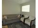 Cozy living room featuring a comfortable sofa, armchairs, and stylish rug at 4624 S 19Th Ave, Phoenix, AZ 85041