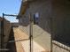 Side yard enclosed by a chain-link gate providing security and privacy at 4624 S 19Th Ave, Phoenix, AZ 85041