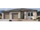 Charming single-story home featuring a neutral color palette, a two-car garage, and desert landscaping at 47198 W Mellen Ln, Maricopa, AZ 85139