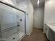 Bright bathroom featuring a sleek glass-enclosed shower and tile flooring at 47230 W Cansados Rd, Maricopa, AZ 85139