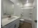 Modern bathroom features a vanity with quartz countertops, updated fixtures, and tile at 47230 W Cansados Rd, Maricopa, AZ 85139