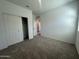 Comfortable bedroom featuring neutral carpet, a closet, and natural light from windows at 47230 W Cansados Rd, Maricopa, AZ 85139