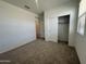 Comfortable bedroom featuring carpet, a closet, and natural light from the windows at 47230 W Cansados Rd, Maricopa, AZ 85139